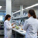 A sophisticated laboratory setting with scientists conducting rigorous quality control tests on health products, emphasizing precision and high standards.